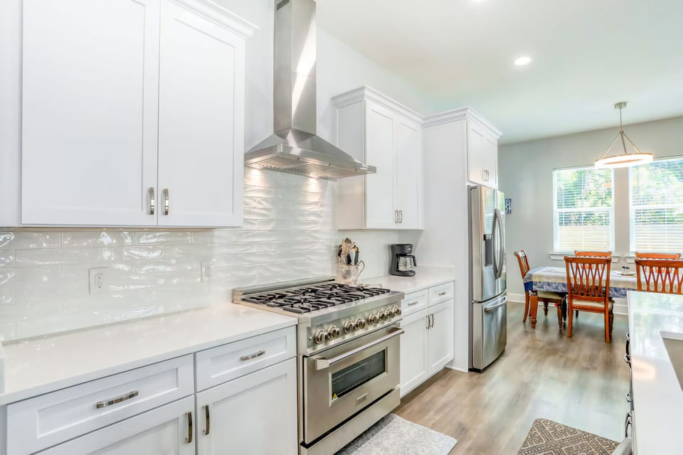 A chef’s dream kitchen, complete with a gas range and modern appliances.