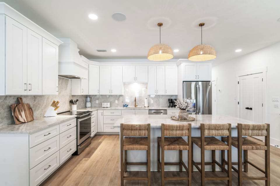 The kitchen features granite countertops paired with a matching backsplash.