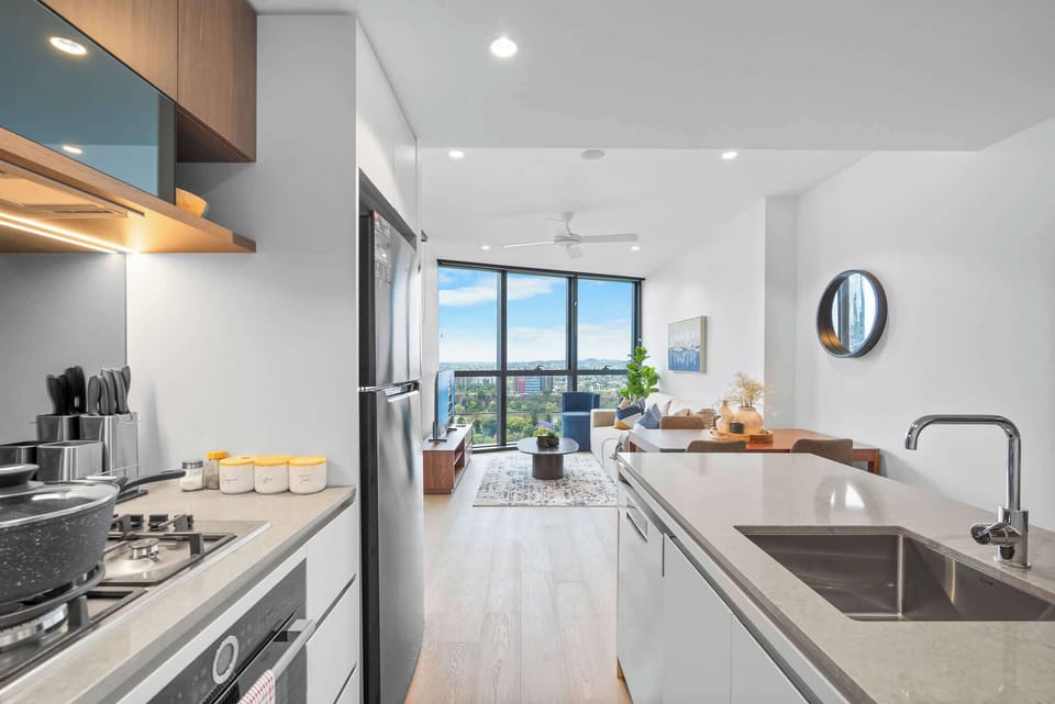 Complimentary Italian-made Lavazza coffee machine with pods, overlooking open-plan living.