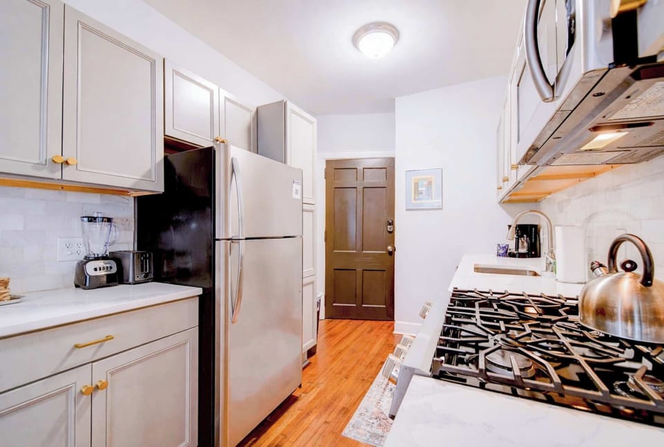 Clean countertops and a full-sized fridge offer the space you need for a weekly grocery haul.