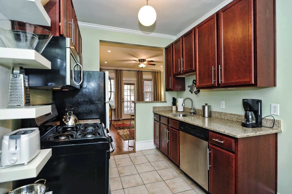 Fully equipped kitchen with essentials, cookware, and space to prepare meals comfortably.