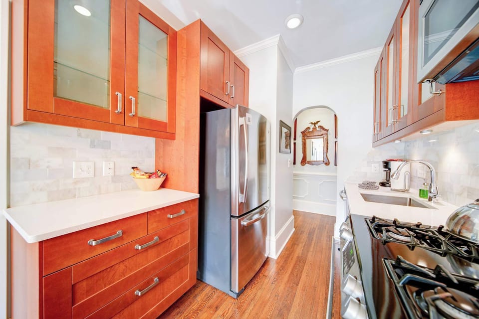 Clean and modern, this kitchen offers sleek cabinetry, stainless steel appliances, and ample counter space. A well-designed area for easy cooking and everyday convenience