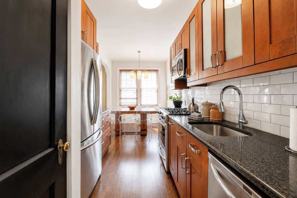 Fully equipped kitchen with essentials, cookware, and space to prepare meals comfortably.