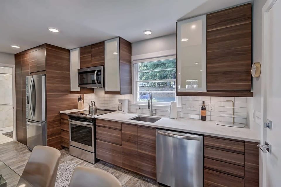 Our fully equipped kitchen is tucked just steps from the dining area for seamless meal prep and serving.