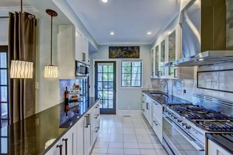 Fully equipped kitchen with modern appliances, cookware, and essentials for easy meals at home.