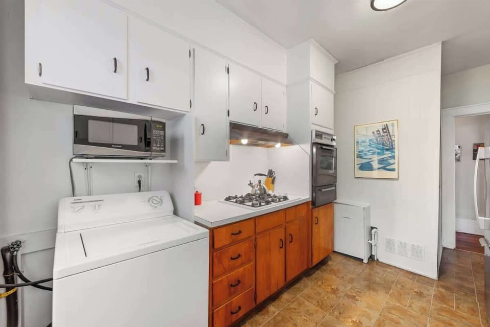 This fully equipped kitchen features a gas range and built-in oven for effortless home-cooked meals.