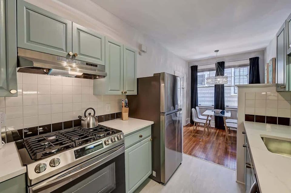 Prepare fresh meals in our fully equipped kitchen featuring a gas range and plenty of sleek counter space.