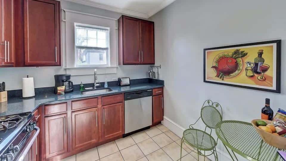 Prepare delicious meals in a fully equipped kitchen featuring stainless steel appliances.