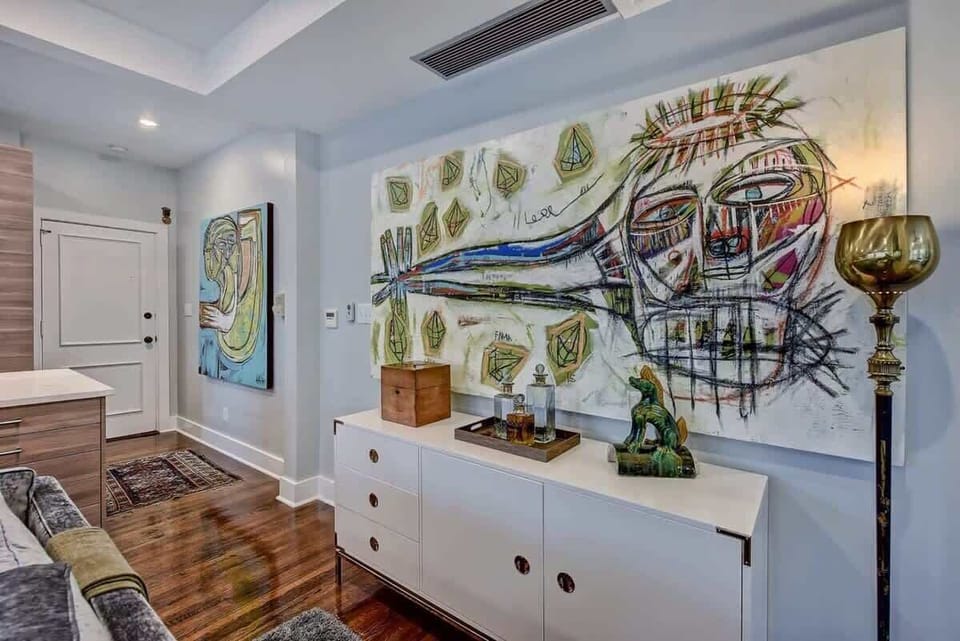 Creative wall art with white cabinets
