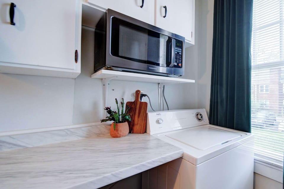 Functional kitchen setup ideal for daily use or longer stays in Charlotte.