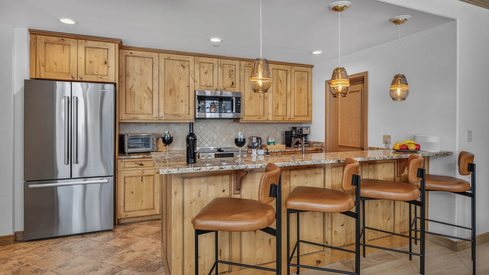 Kitchen, Main Level - With four barstools.