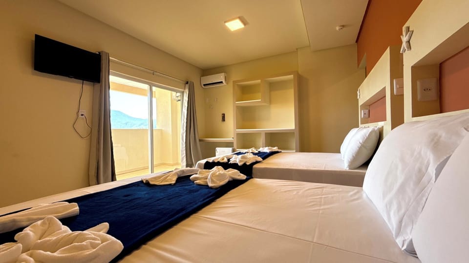 Standard Quadruple Room, 2 Double Beds | Minibar, desk, laptop workspace, free WiFi