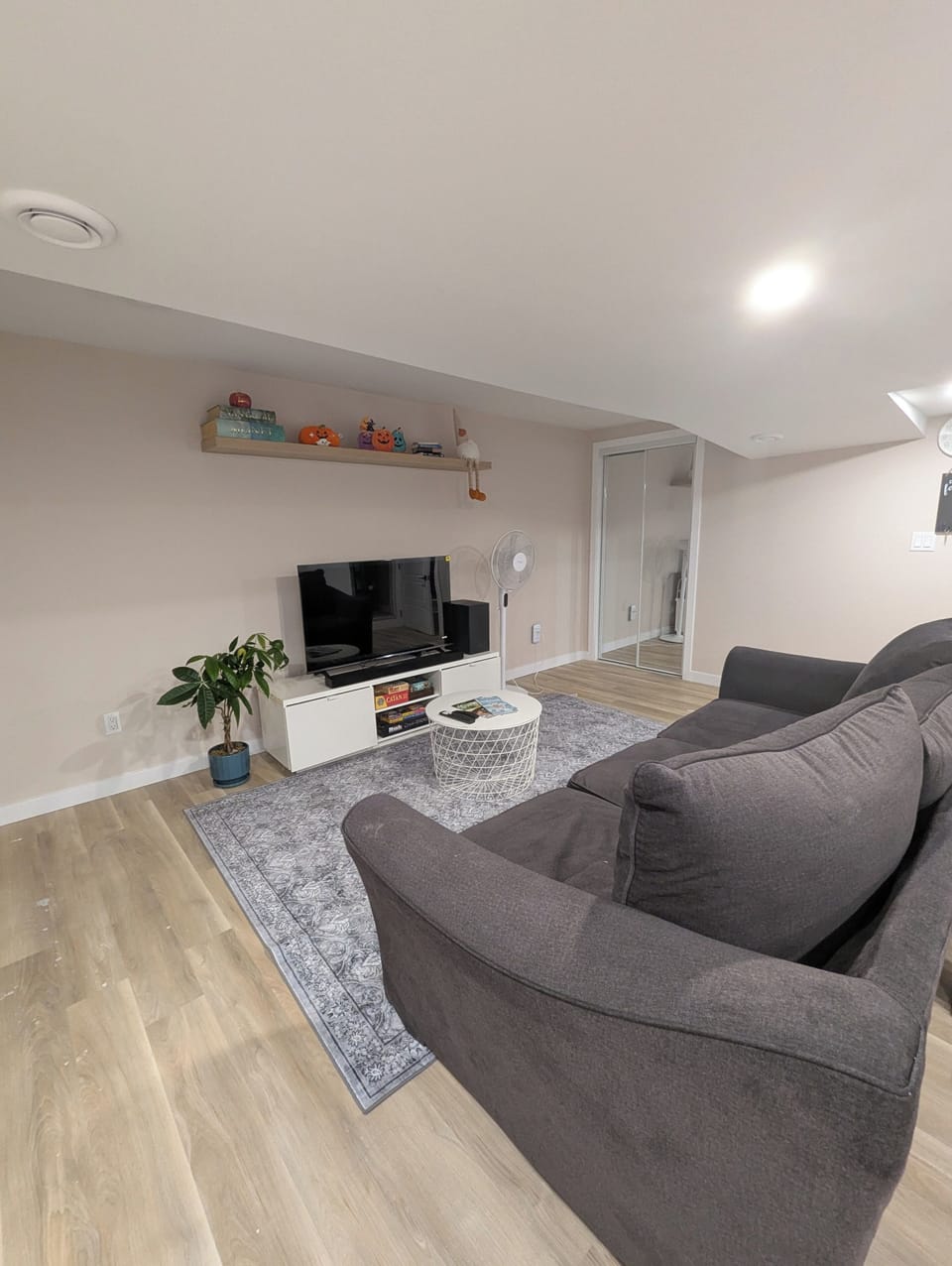 open space living area with smart tv that includes netflix and disney+