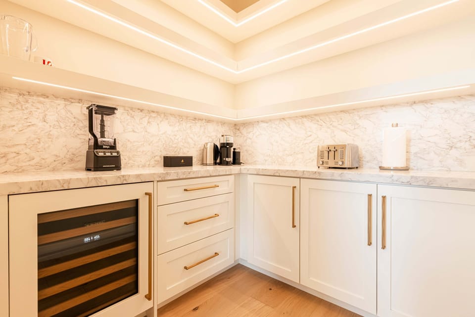 "Hidden" pantry with a wine fridge and more small appliances