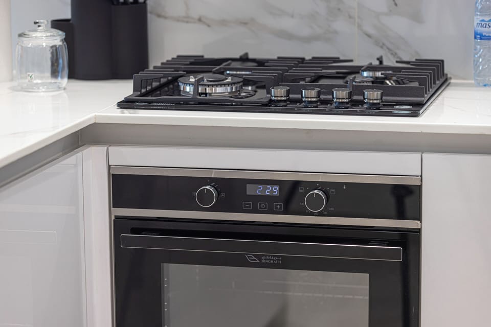 Deluxe Apartment, Balcony, City View | Private kitchen | Electric kettle, toaster, mixer, cleaning supplies