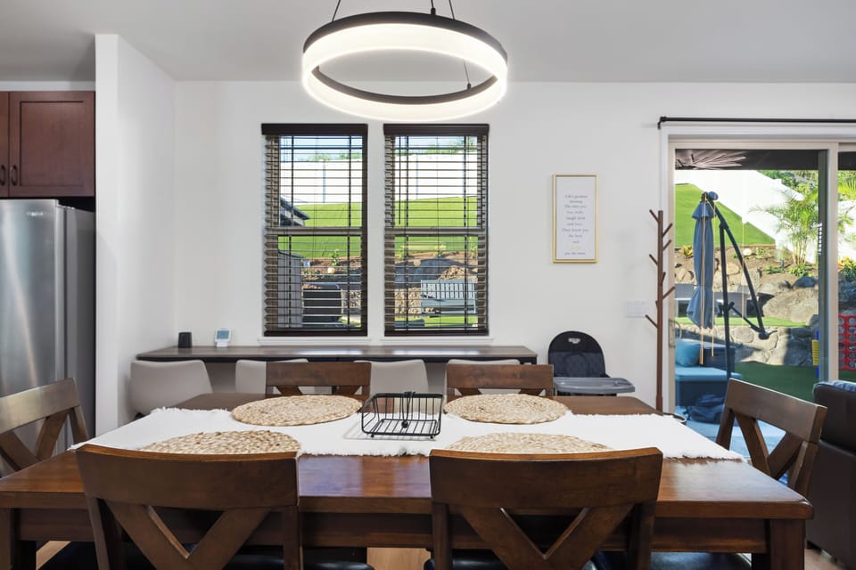 Dining area with modern lighting and bright open layout!