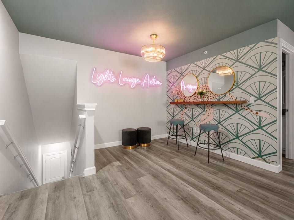 Pose by the neon sign and hand-painted cheetah mural for memorable photos.