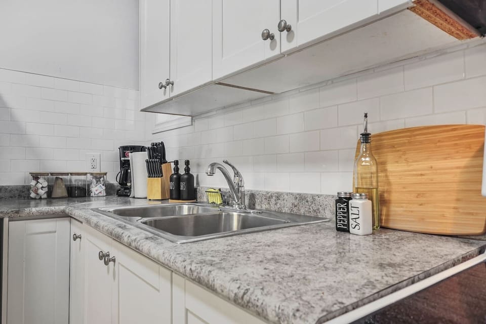 Prepare your favorite meals in this well organized kitchen. With plenty of counter space and essential seasonings at your fingertips, you will find everything you need to feel at home while enjoying a seamless cooking experience during your stay.