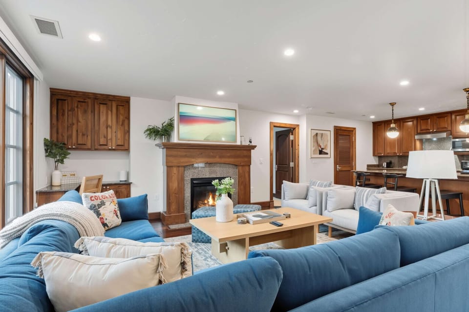 Living room: Gas fireplace, Samsung Frame TV, large sectional