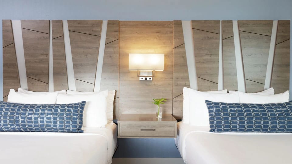 Unwind in boutique style with plush pillows and warm lighting.