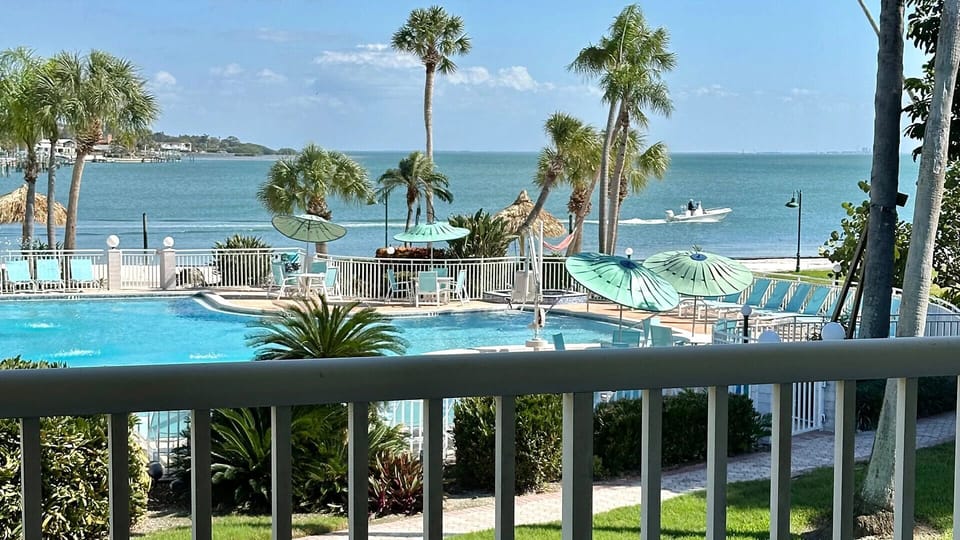Soak in sunshine with pool and bay views.