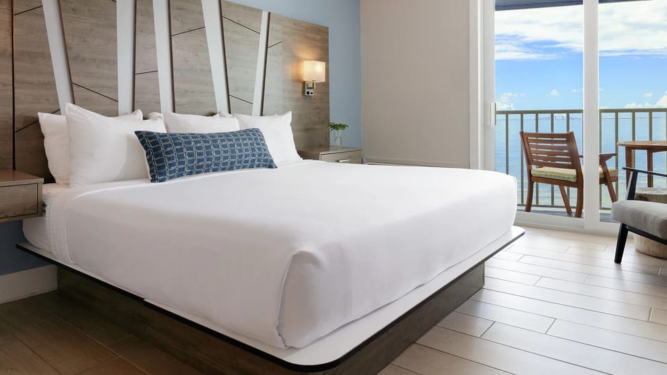 Stretch out on a king bed with balcony bay breezes.