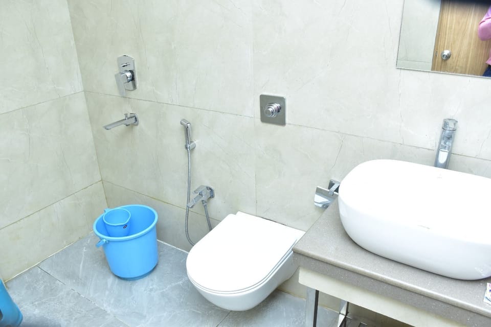 Shower, rainfall showerhead, towels, soap