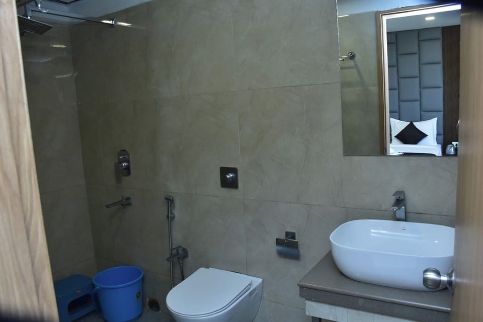 Shower, rainfall showerhead, towels, soap