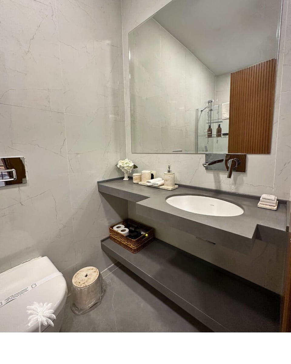 Shower, hair dryer, slippers, towels