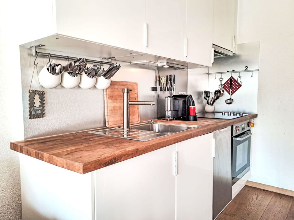 Kitchen, Countertop, Kitchen Appliance, Cabinetry, Wood, Major Appliance, Interior Design, Flooring, Plumbing Fixture, Home Appliance