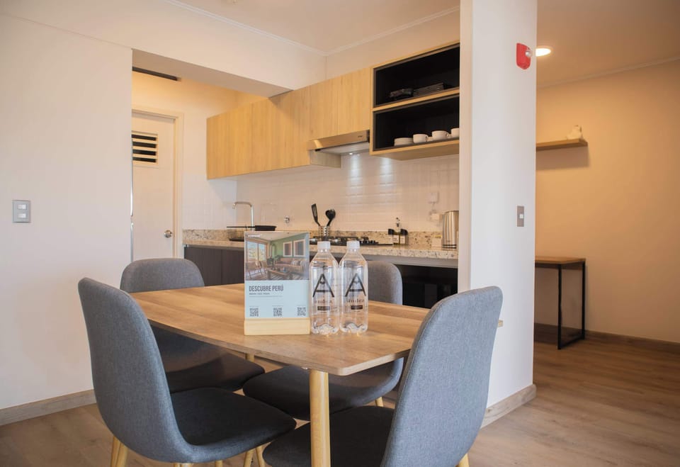 Dining room next to modern kitchen