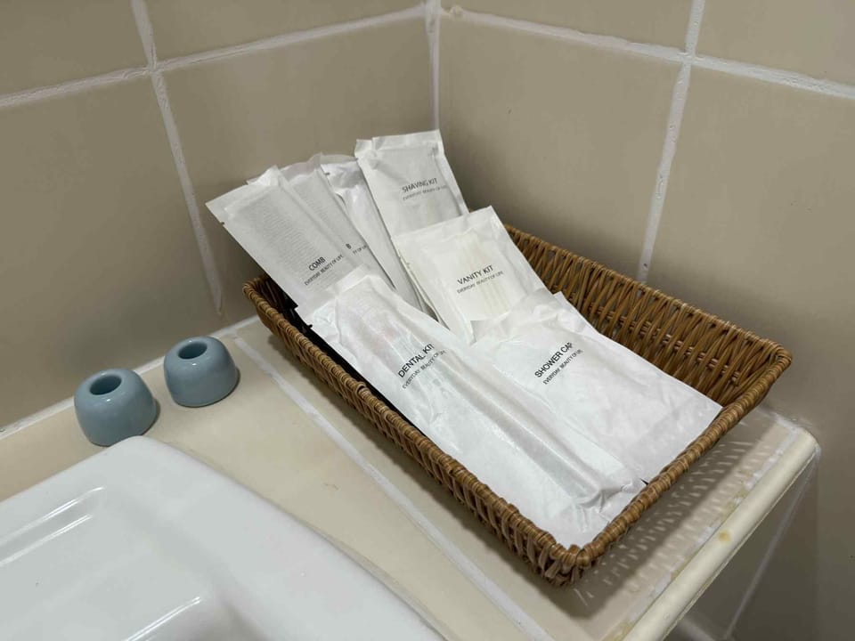 Hair dryer, slippers, towels, soap