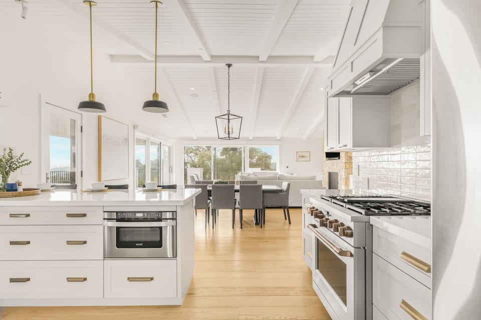 The kitchen features barstool seating, ample counter space and reliable appliances. (Main house)