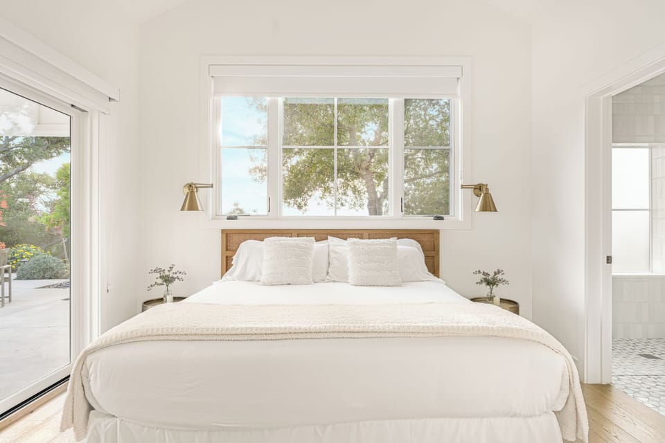 The Pool House's bedroom features a king bed, access to the pool area and an ensuite bathroom. (Bedroom 4)