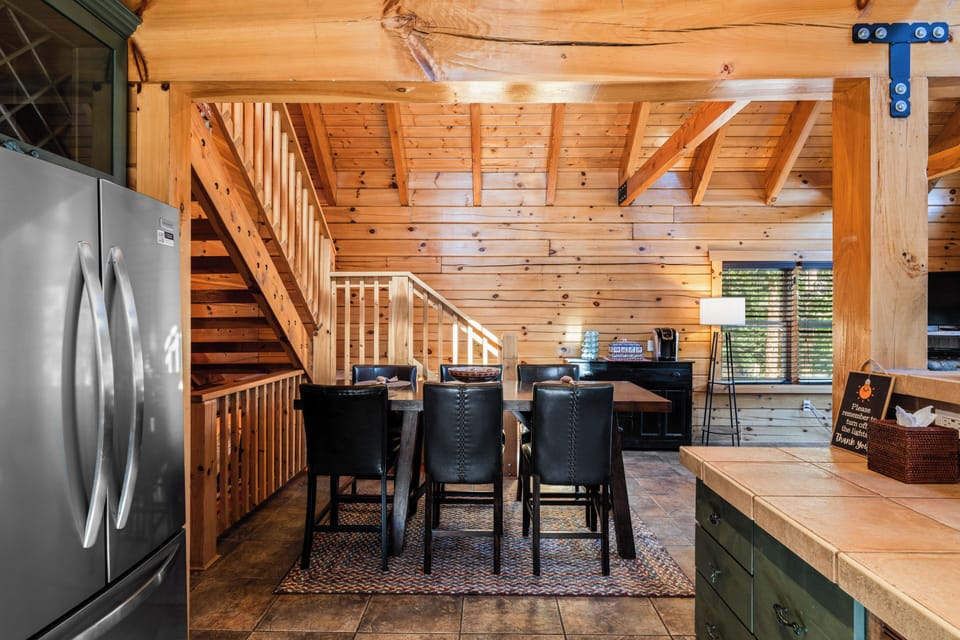 Dining area with seating for six, ideal for family meals.