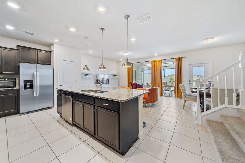 Fully equipped kitchen with stainless steel appliances — everything you need for family dining