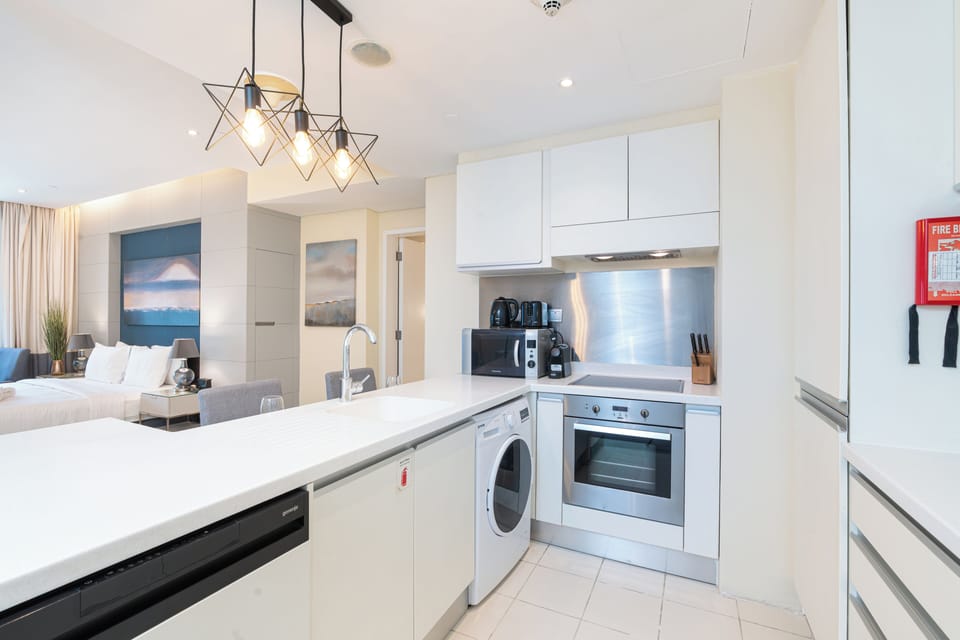 Luxury Studio, Balcony | Private kitchen | Full-size fridge, microwave, oven, stovetop