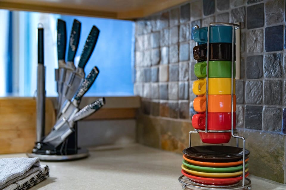 Crestview Commons A207: Kitchen is fully stocked with dishware, bakeware, and cookware.