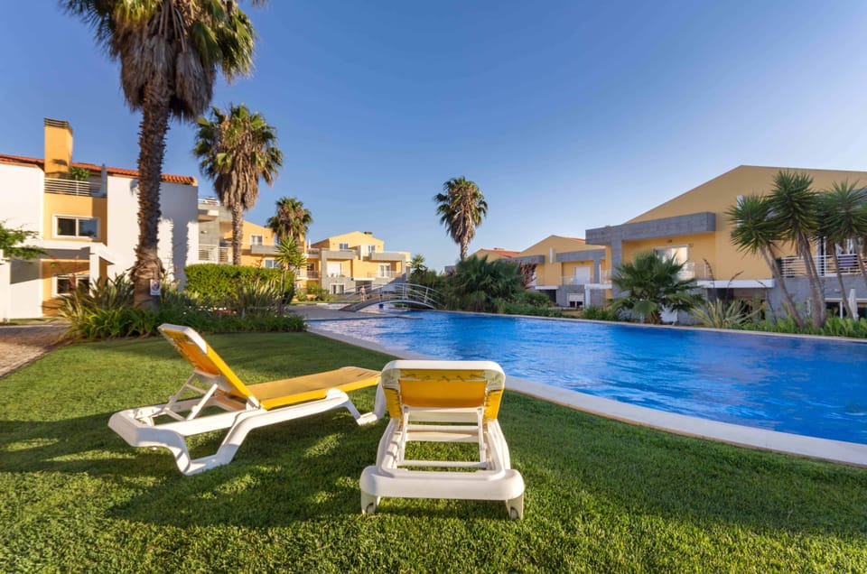 Gated condo with 40m pool with sun loungers and lush gardens