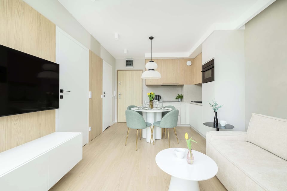 Stylish interior that connects living, dining, and kitchen areas in one harmonious space. Ideal for relaxing or entertaining guests.