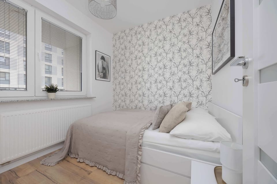 The bedroom's elegant decor creates a serene and restful environment.