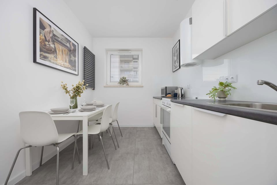 The kitchen offers a functional layout for convenient cooking.