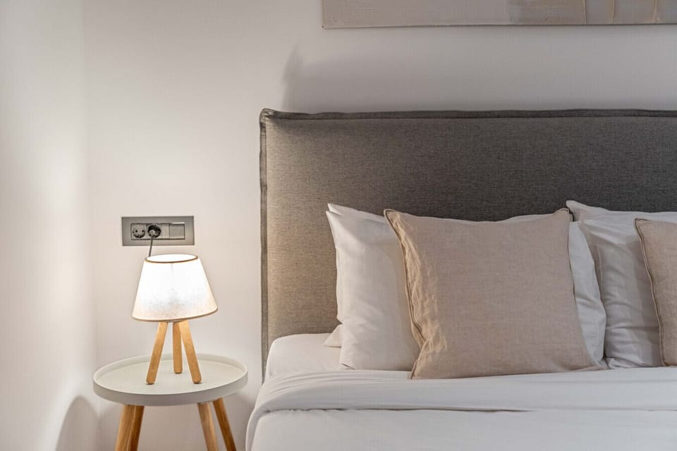 Soft ambient glow and tactile linens — a study in comfort, calm, and understated luxury.