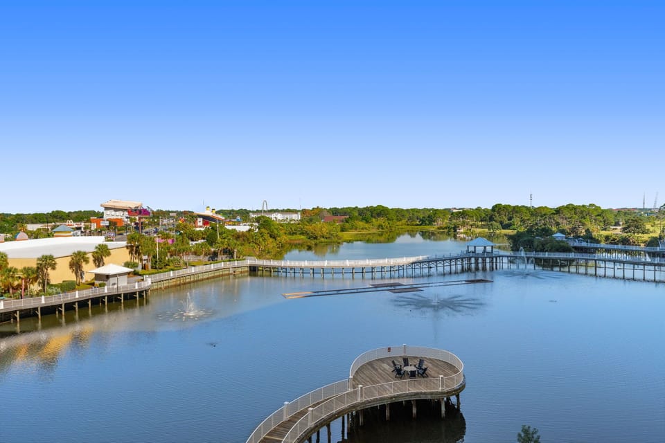 Scenic waterfront view with a wooden pier extending over calm waters.