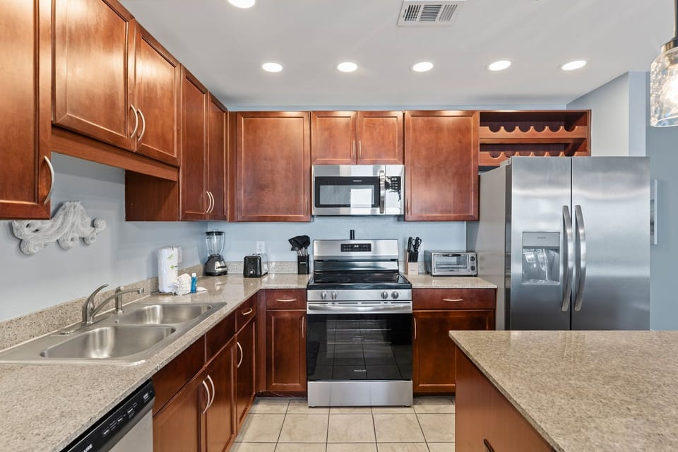 Modern kitchen with stainless steel appliances and ample wooden cabinetry