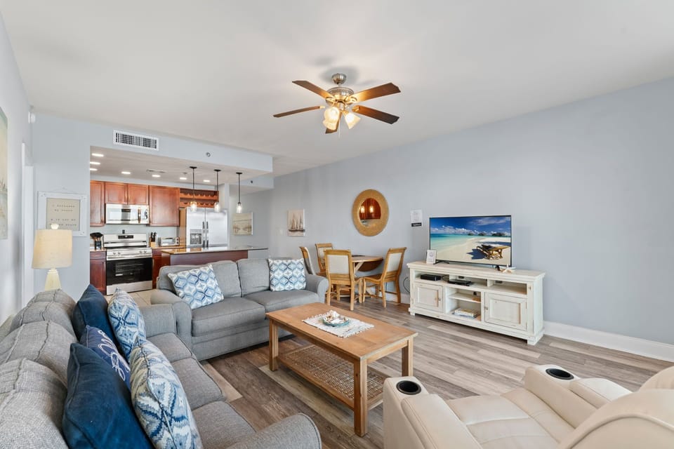 Open-concept living area with modern kitchen and comfortable seating for relaxing or entertaining.