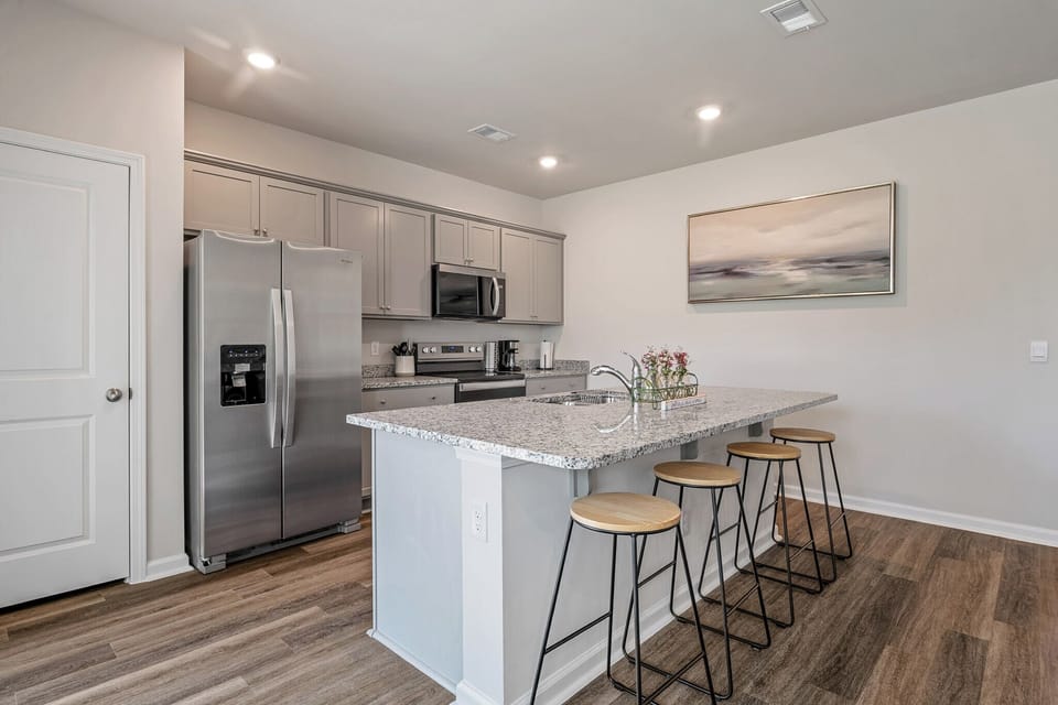 “Fully equipped kitchen with stainless steel appliances"