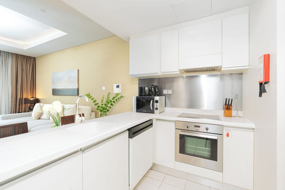 Luxury Apartment, Balcony, City View | Private kitchen | Full-size fridge, microwave, oven, stovetop