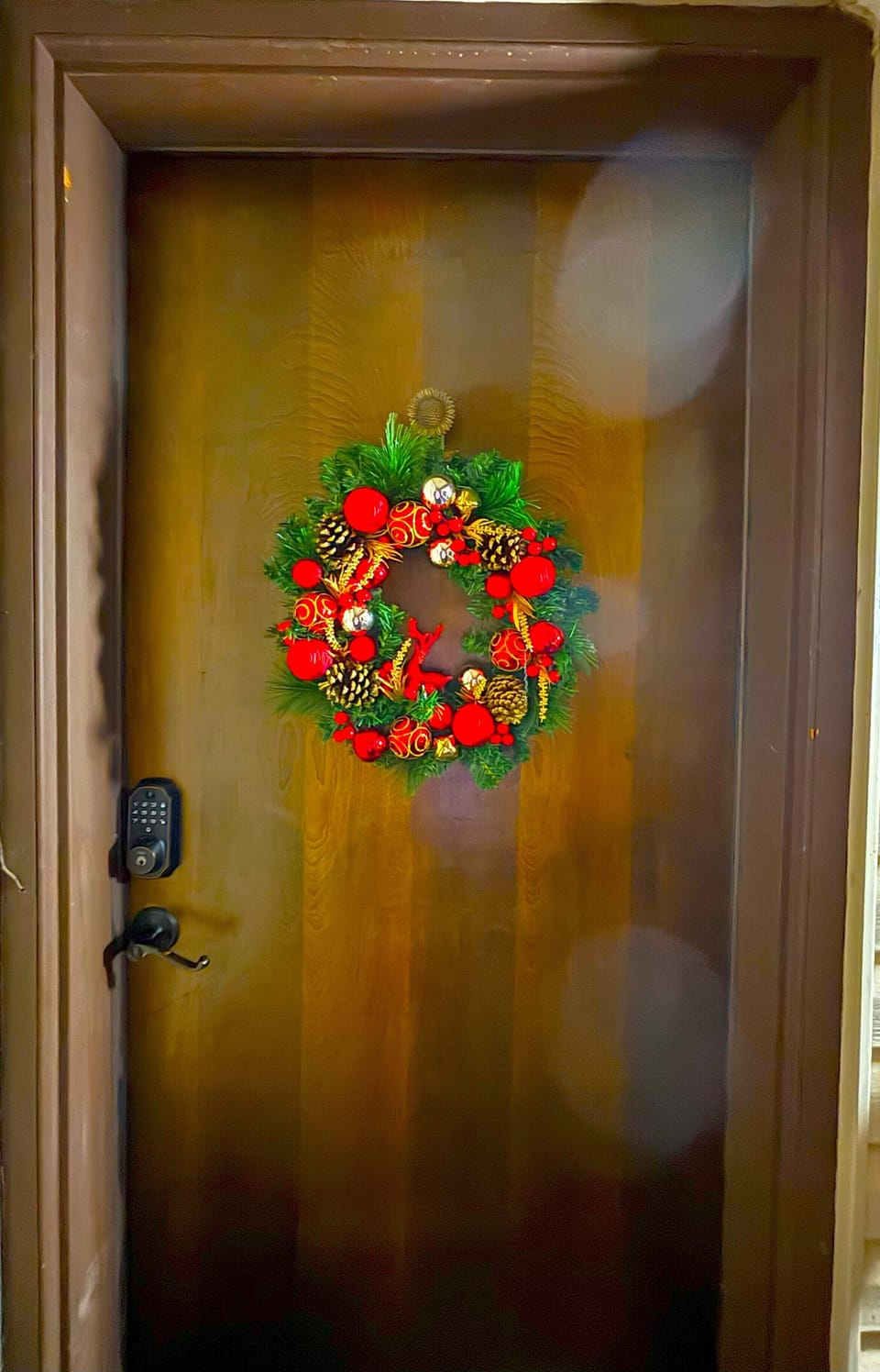The front door of the condo with electronic lock.
