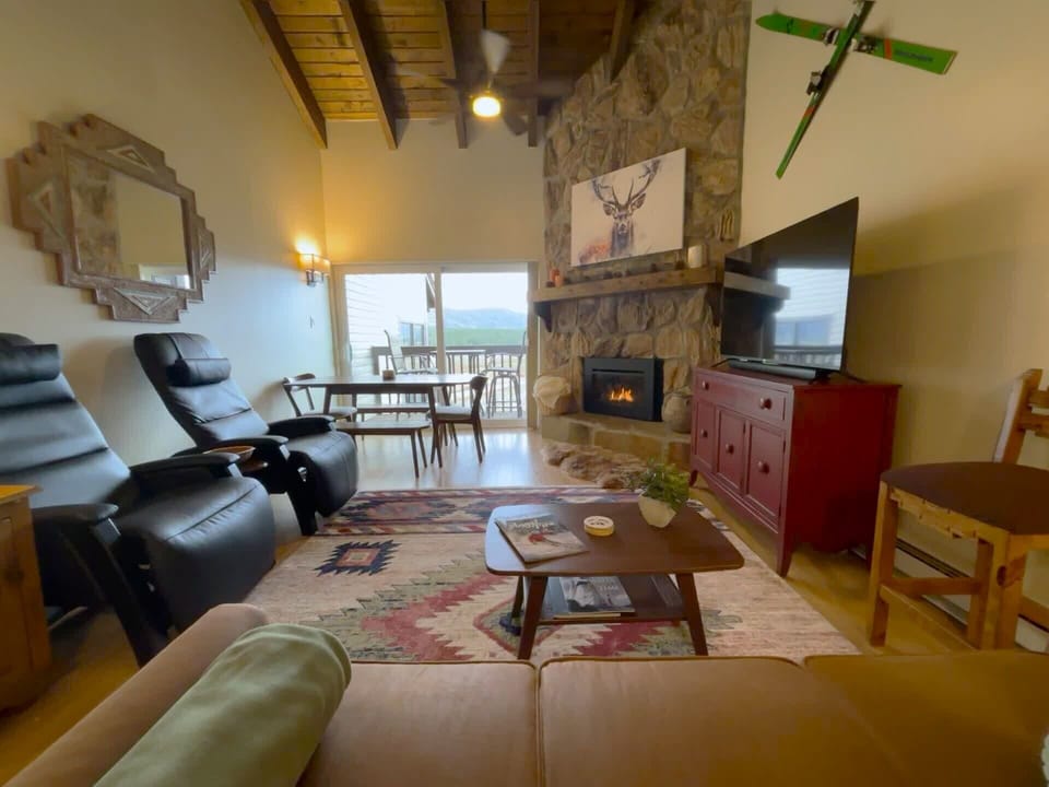 The overall view from the kitchen of a bright and spacious room.